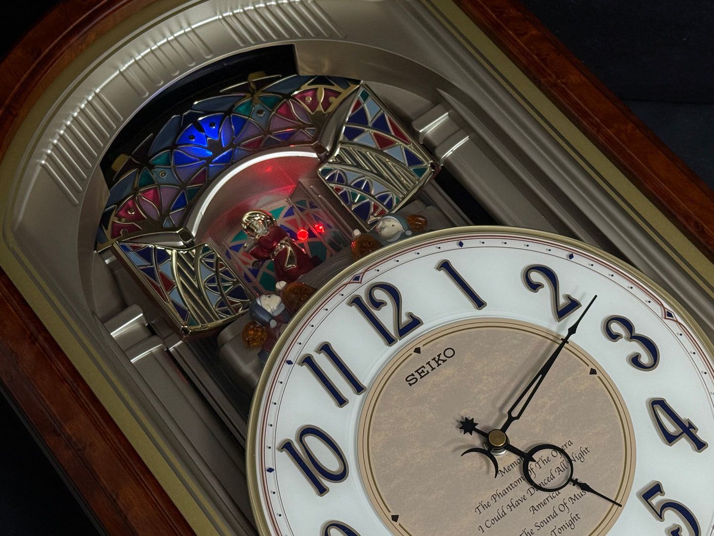 Seiko QXM123BRH "Broadway Showtunes Dropping Dial" Melodies in Motion Musical Moving Wall Clock with Popular Melodies