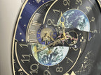 Rhythm “Peaceful Cosmos” Moving Earth Dial Magic Motion Musical Wall Clock with Popular Melodies - 4MH751AR19