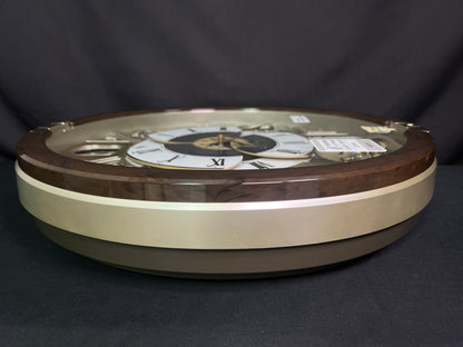 Seiko QXM371BRH “Castle Windows” Melodies in Motion Dancing Dial Musical Wall Clock