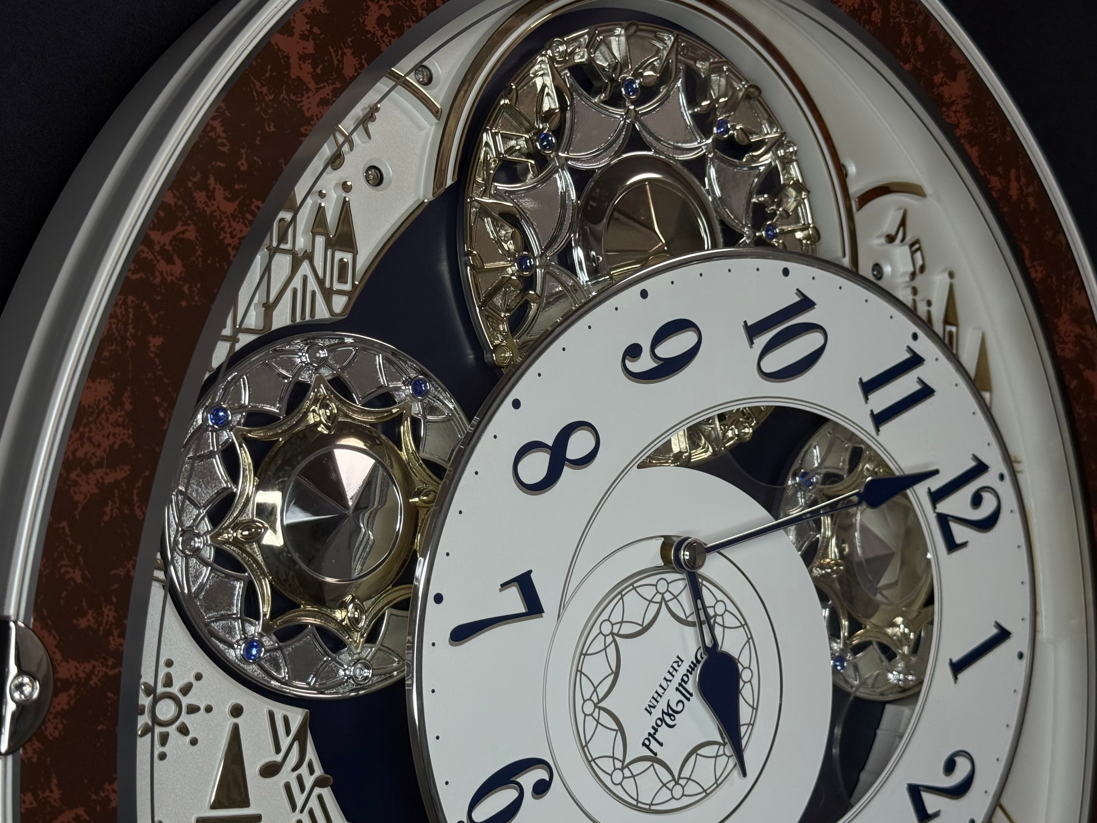 Rhythm "Gala III" Magic Motion Musical Wall Clock with Rotating Dial - 4MH447WU23