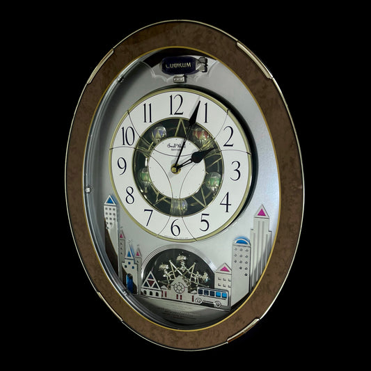 Rhythm “Tri-Cracker” Magic Motion Musical Wall Clock with Moving Dial and Balloons - 4MH759NR06