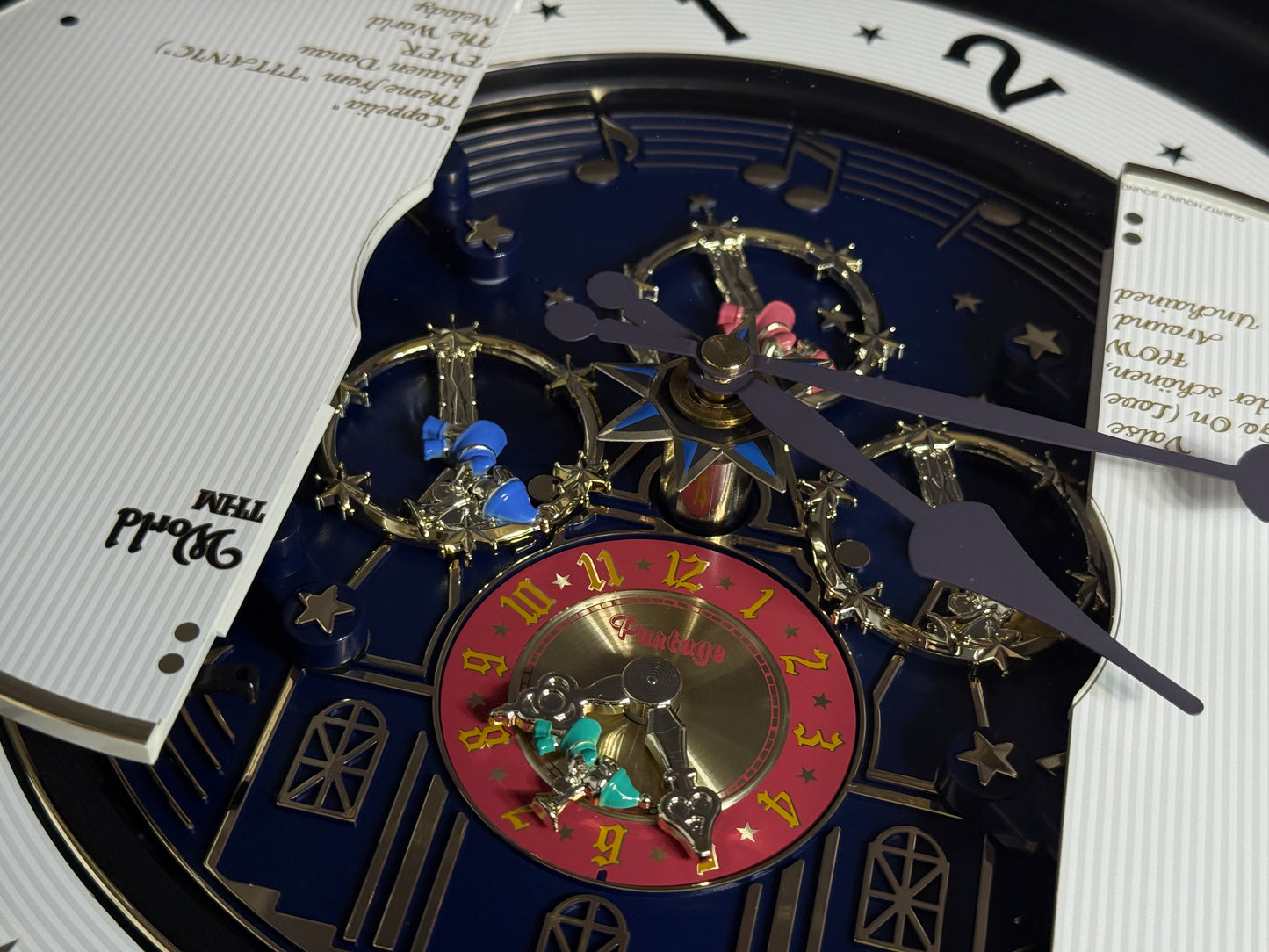 Rhythm “Small World Partage Home (Blue)” Moving Dial Magic Motion Musical Wall Clock with Popular Melodies - 4MH754RH04