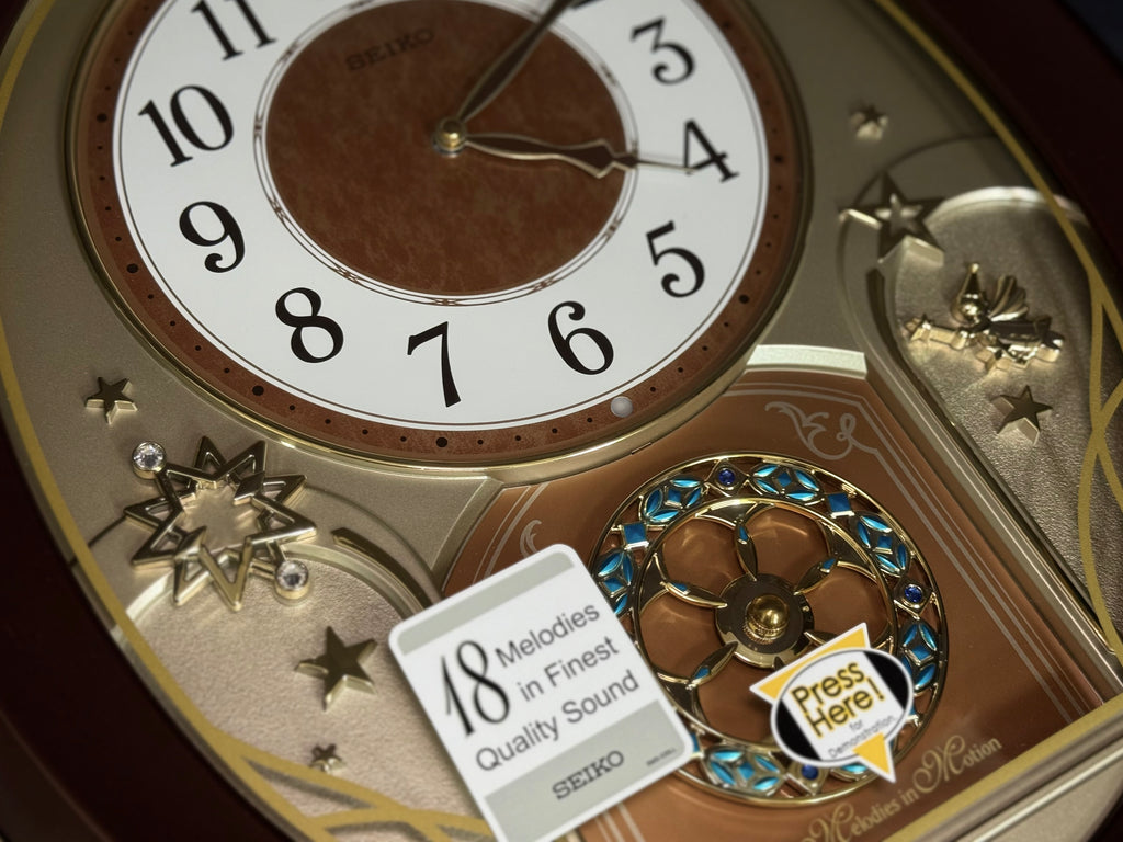 Seiko QXM357BRH “Warm Summer Stars” Melodies in Motion Musical Decorative Moving Wall Clock with 19 Songs