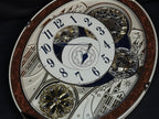 Rhythm "Gala III" Magic Motion Musical Wall Clock with Rotating Dial - 4MH447WU23