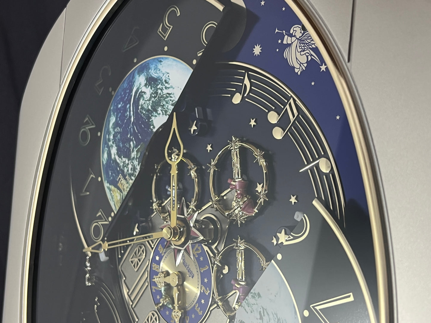 Rhythm “Peaceful Cosmos” Moving Earth Dial Magic Motion Musical Wall Clock with Popular Melodies - 4MH751AR19