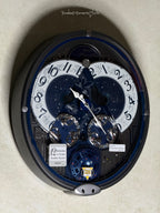 Seiko QXM393NRH “Galaxy Constellations” Astrology-Themed Melodies in Motion Moving Dial Musical Wall Clock with Luminous Dial & 12 Songs