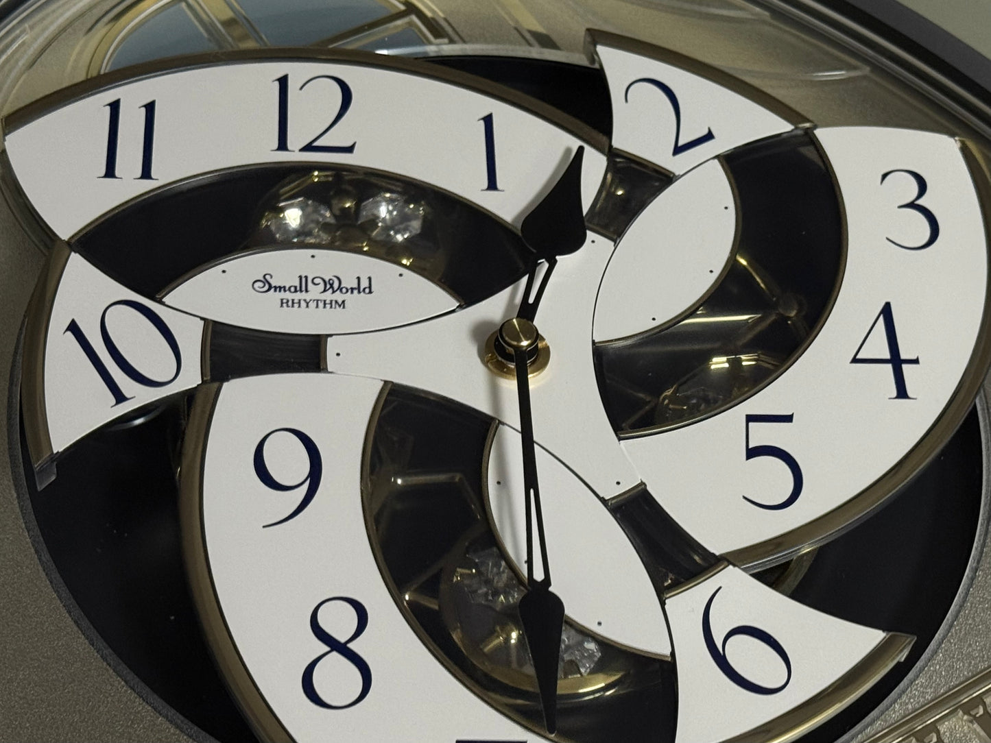 Rhythm "CTS Brilliance" Moving Dial Magic Motion Musical Wall Clock with Popular Melodies - 4MH787-R18