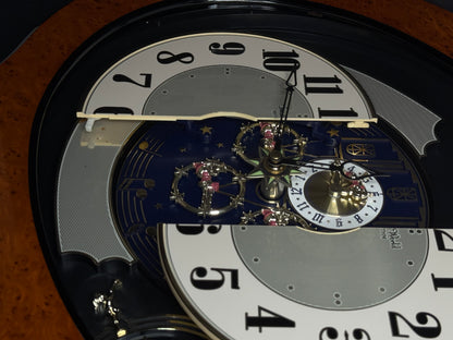 Rhythm “DWS Timecracker” Moving Dial Magic Motion Musical Wooden Wall Clock with Popular Melodies - 4MH752-R06