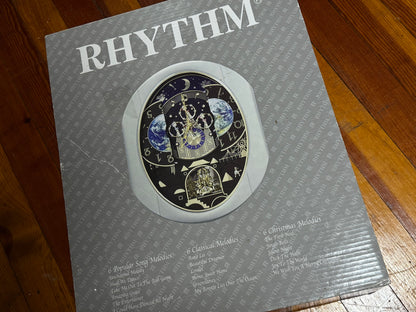 Rhythm “Peaceful Cosmos Entertainer” Moving Earth Dial Magic Motion Musical Wall Clock with Popular Melodies - 4MH839WB19