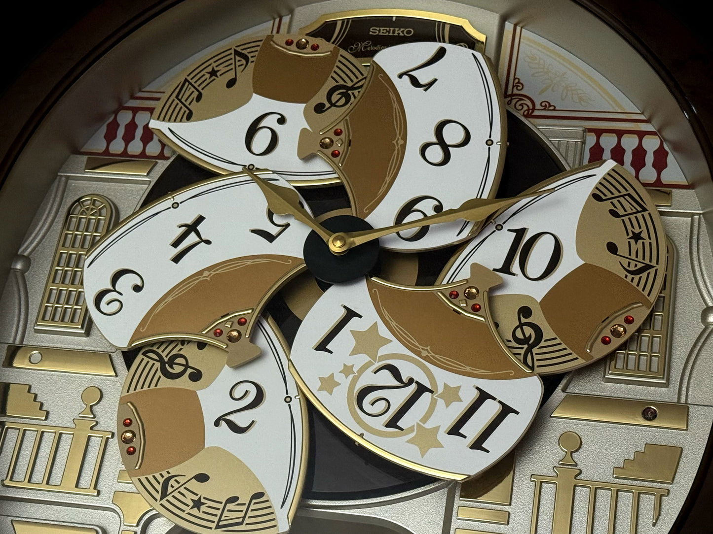 Seiko QXM607BRHZ “Concert Hall” Melodies in Motion Dancing Dial Musical Wall Clock with 45 Songs