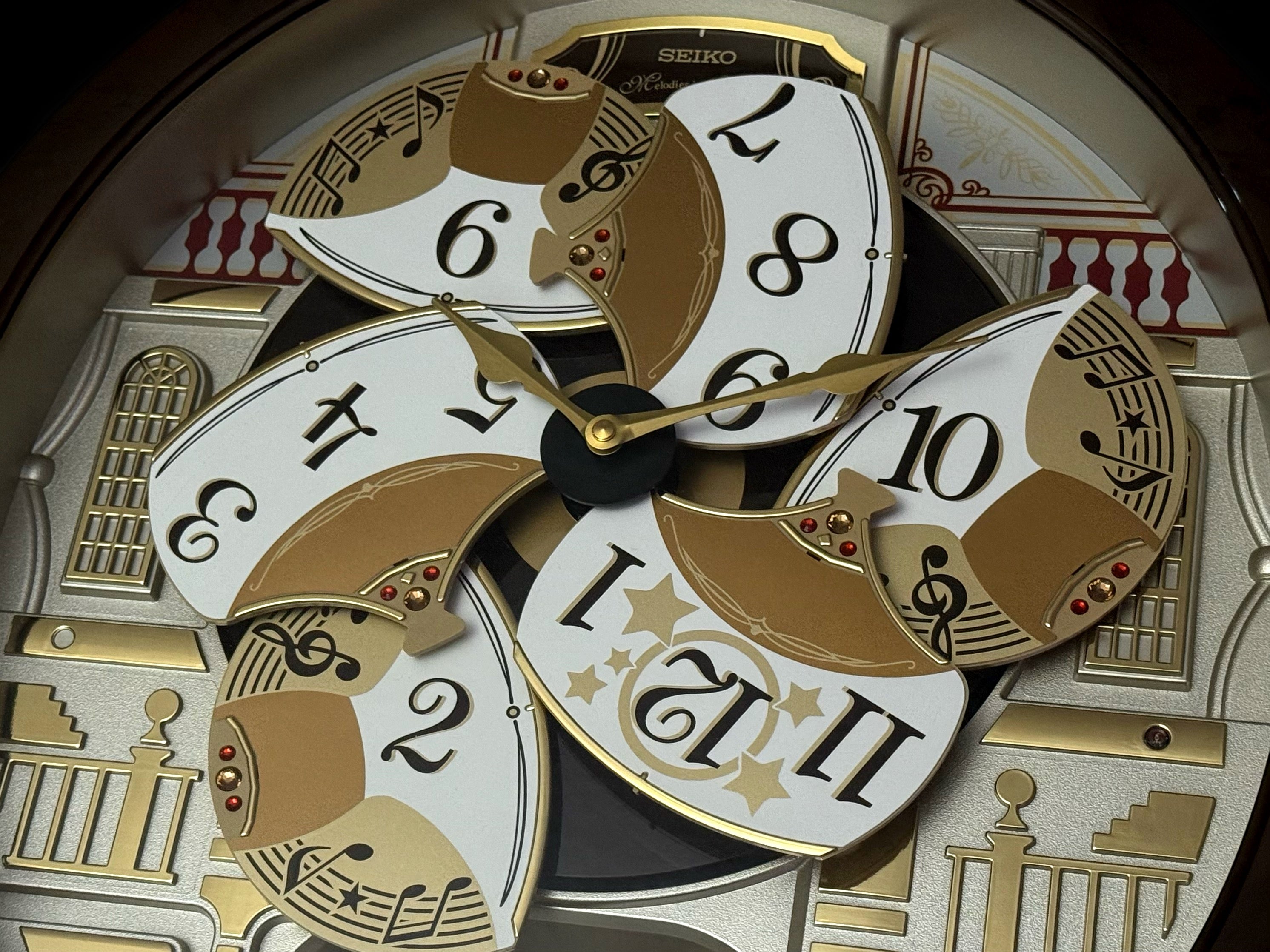 Seiko QXM607BRHZ “Concert Hall” Melodies in Motion Dancing Dial Musical Wall Clock with 45 Songs