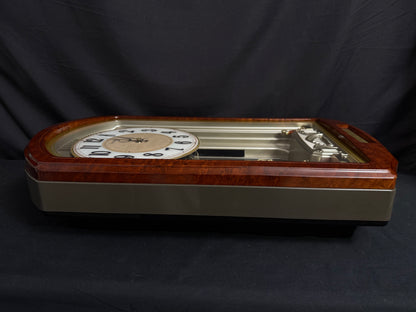 Seiko QXM223BRH "Classic Dropping Dial" Melodies in Motion Musical Moving Wall Clock