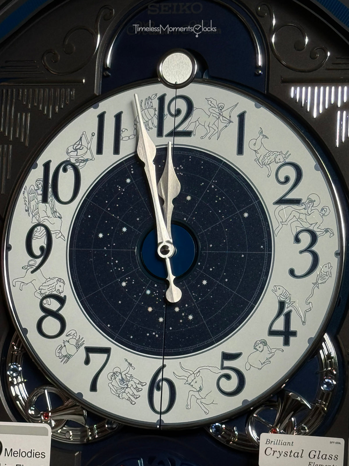 Seiko QXM393NRH “Galaxy Constellations” Astrology-Themed Melodies in Motion Moving Dial Musical Wall Clock with Luminous Dial & 12 Songs