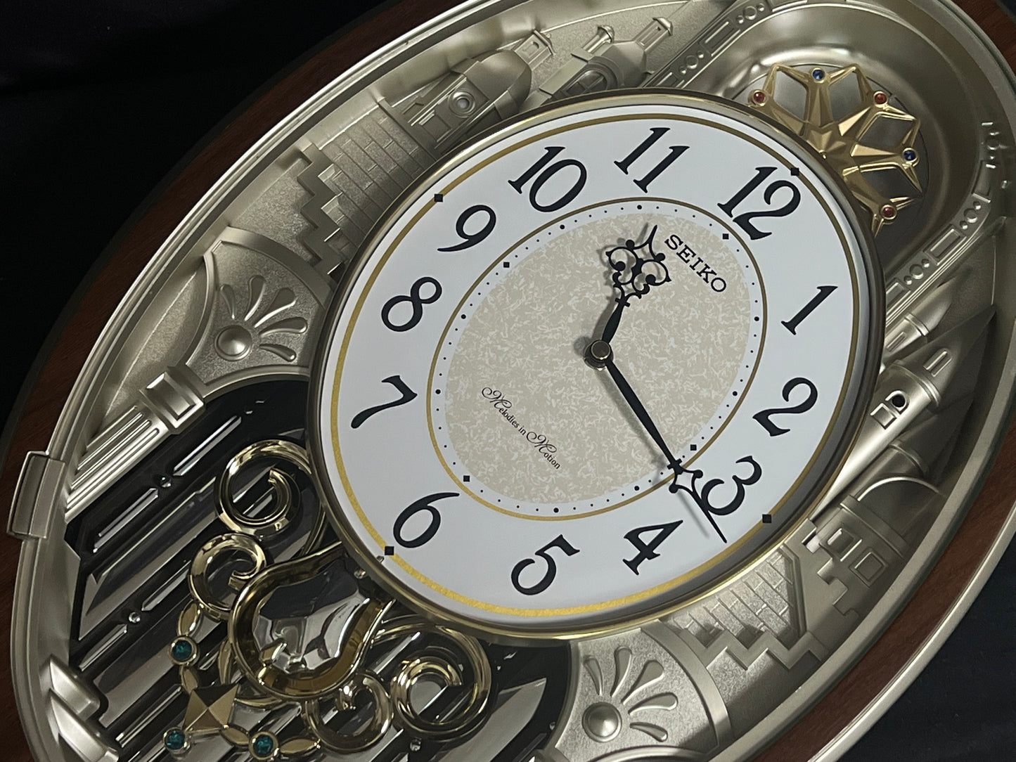 Seiko QXM369BRH “Golden Citadel” Melodies in Motion Musical Decorative Pendulum Wall Clock