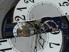 Rhythm "Timecracker Golden Oak" Moving Dial Magic Motion Musical Wooden Wall Clock with Popular Melodies - 4MH782-R07