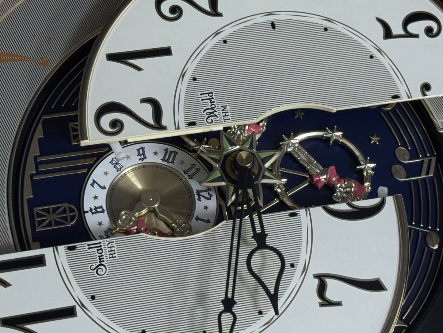 Rhythm "Timecracker Golden Oak" Moving Dial Magic Motion Musical Wooden Wall Clock with Popular Melodies - 4MH782-R07