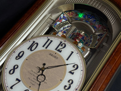 Seiko QXM123BRH "Broadway Showtunes Dropping Dial" Melodies in Motion Musical Moving Wall Clock with Popular Melodies
