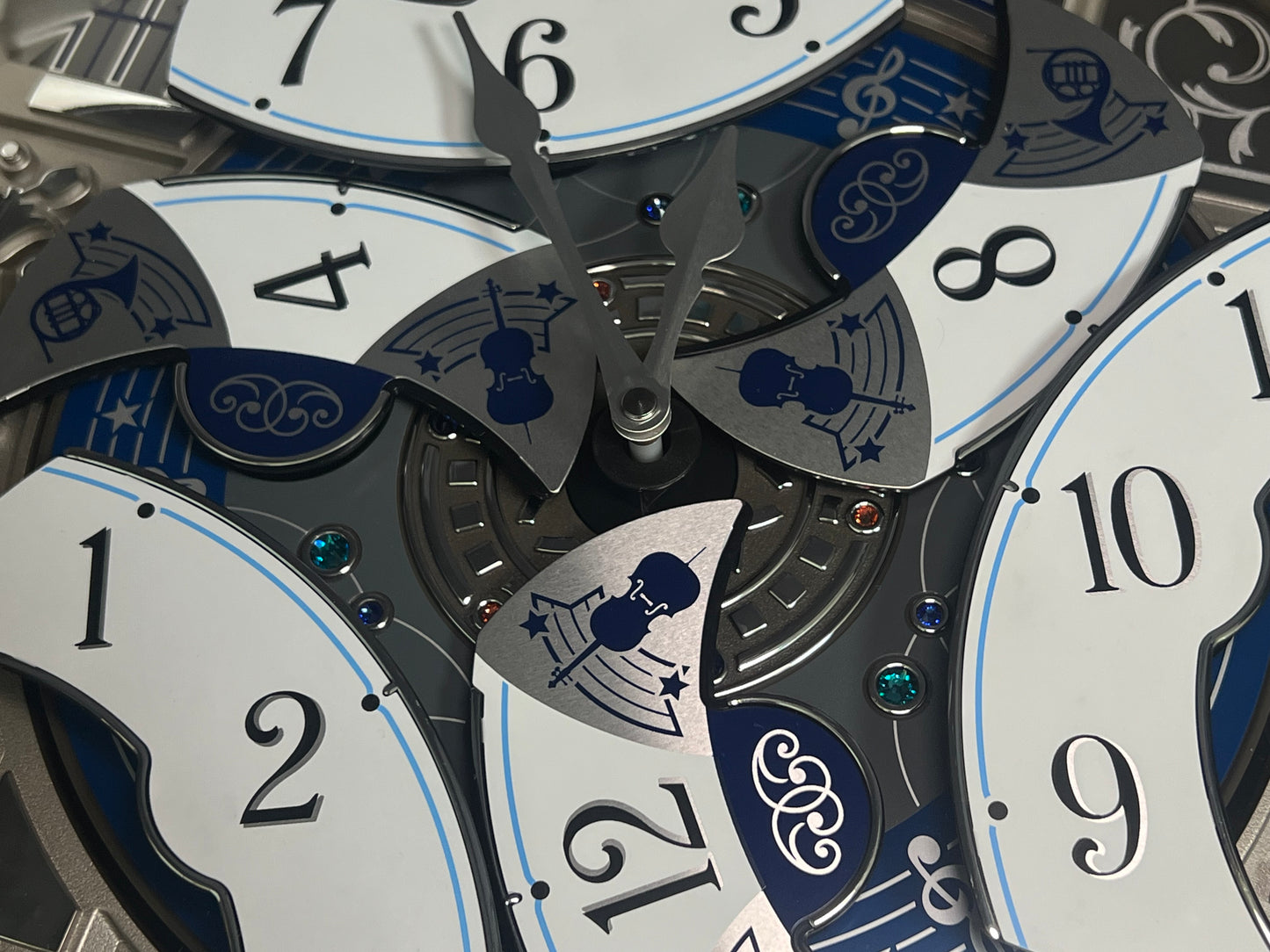 Seiko QXM366SRH “Musical Motifs” Melodies in Motion Dancing Dial Musical Wall Clock