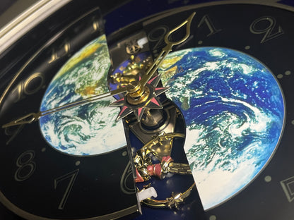 Rhythm “Peaceful Cosmos” Moving Earth Dial Magic Motion Musical Wall Clock with Popular Melodies - 4MH751AR19