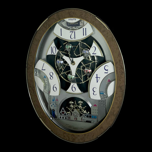 Rhythm “Tri-Cracker” Moving Dial Magic Motion Musical Wall Clock with Popular Melodies - 4MH759NR06