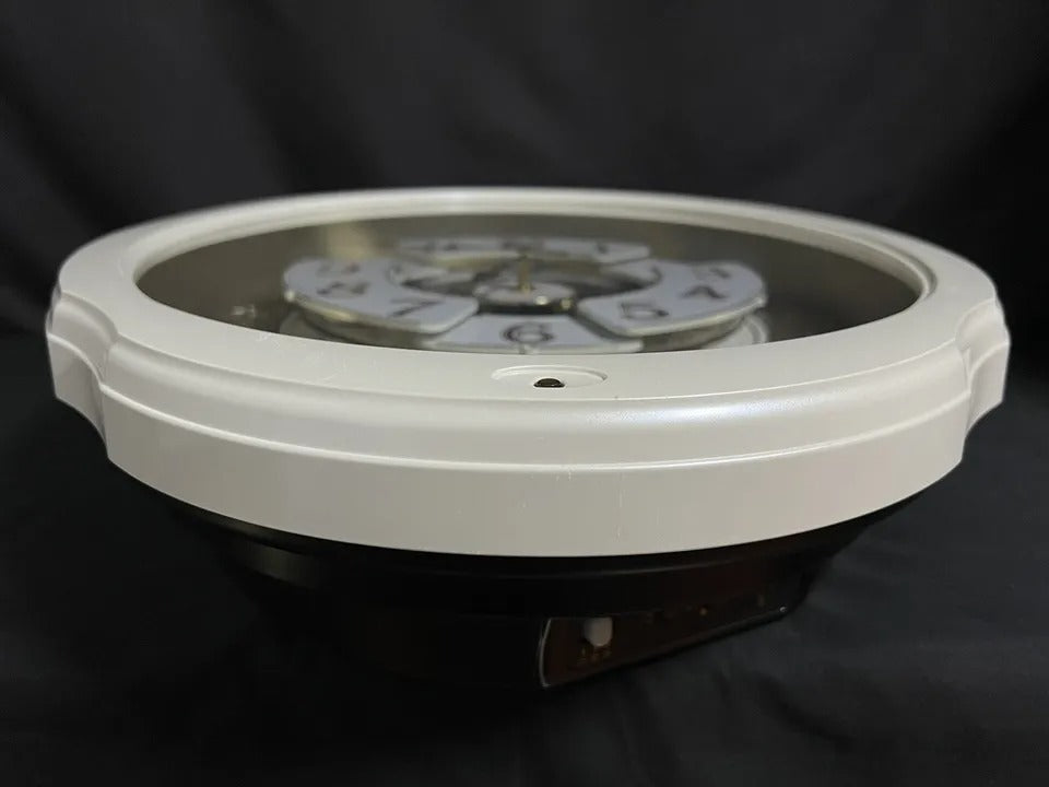 Rhythm "Marvelous Pearl" Magic Motion Musical Wall Clock with Moving Dial - 4MH427WU03