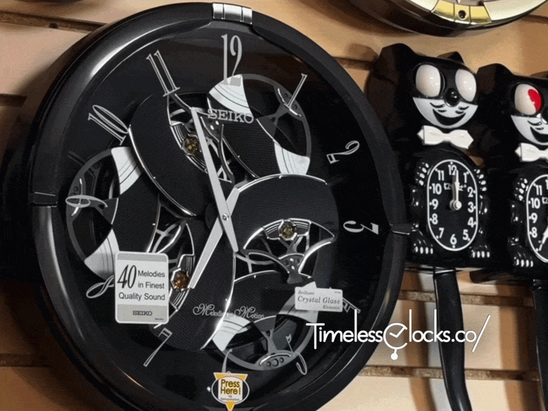 Seiko QXM621KRH “Onyx” Melodies in Motion Dancing Dial Musical Wall Clock with 40 Songs