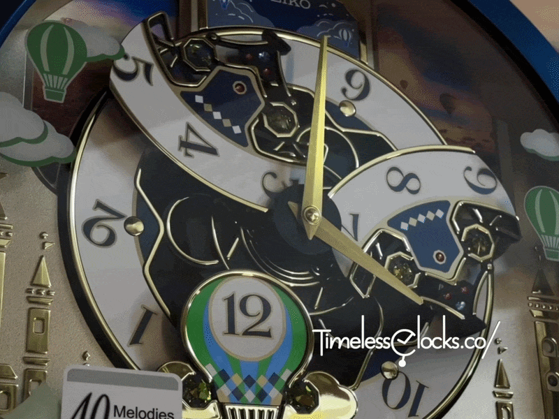 Seiko QXM398LRH “Blue Pine Fantasy” Melodies in Motion Dancing Dial Musical Wall Clock with 40 Songs