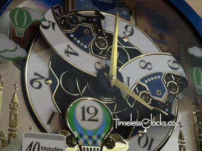 Seiko QXM398LRH “Blue Pine Fantasy” Melodies in Motion Dancing Dial Musical Wall Clock with 40 Songs