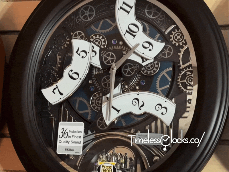 Seiko QXM609NRH “Opera” Melodies in Motion Dancing Dial Musical Wooden Wall Clock with 36 Songs