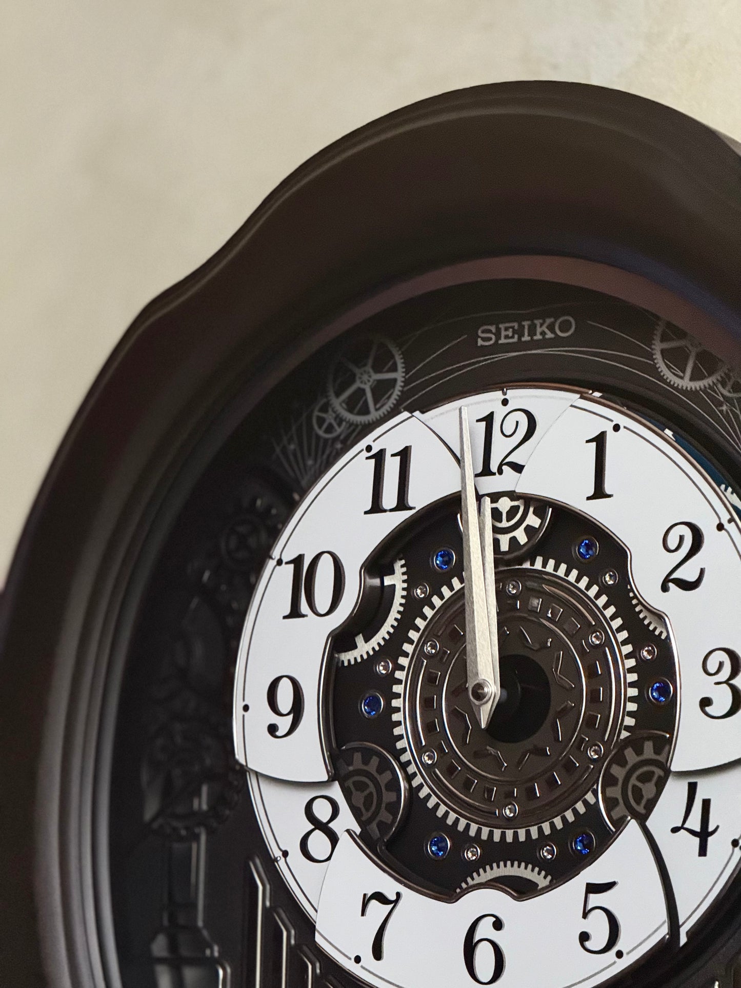 Seiko QXM609NRH “Opera” Melodies in Motion Dancing Dial Musical Wooden Wall Clock with 36 Songs