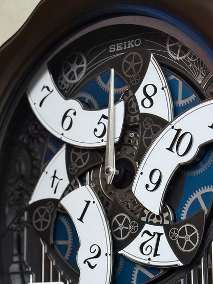 Seiko QXM609NRH “Opera” Melodies in Motion Dancing Dial Musical Wooden Wall Clock with 36 Songs