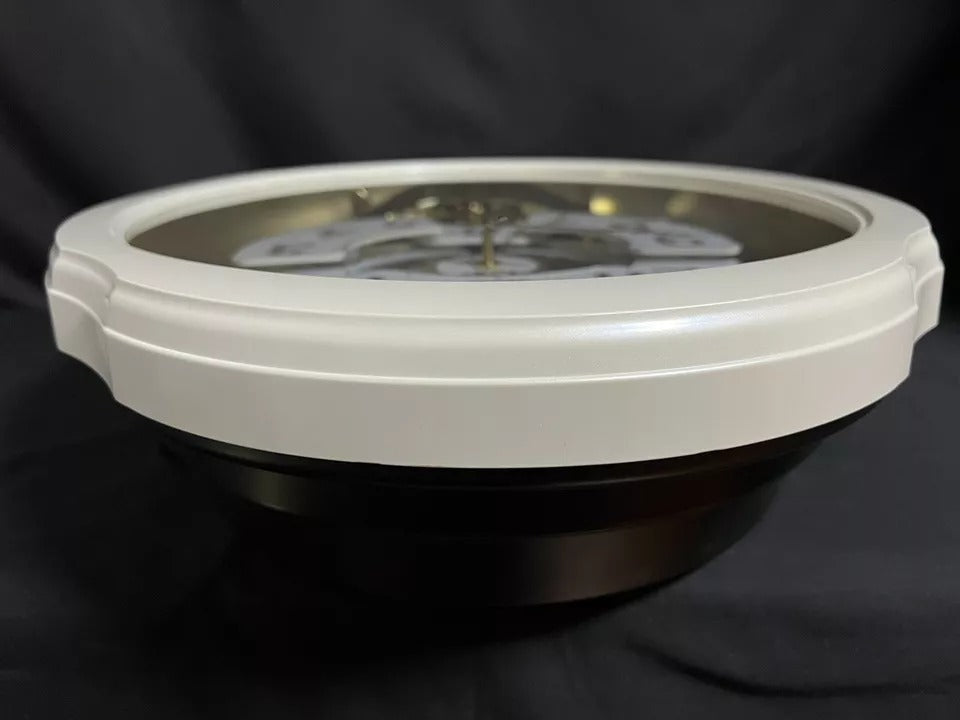 Rhythm "Marvelous Pearl" Magic Motion Musical Wall Clock with Moving Dial - 4MH427WU03