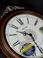 Rhythm “WSM Lauren” Antique-Style Wooden Musical & Chiming Pendulum Wall Clock with Intricate Carved Frame - CMJ380CR06