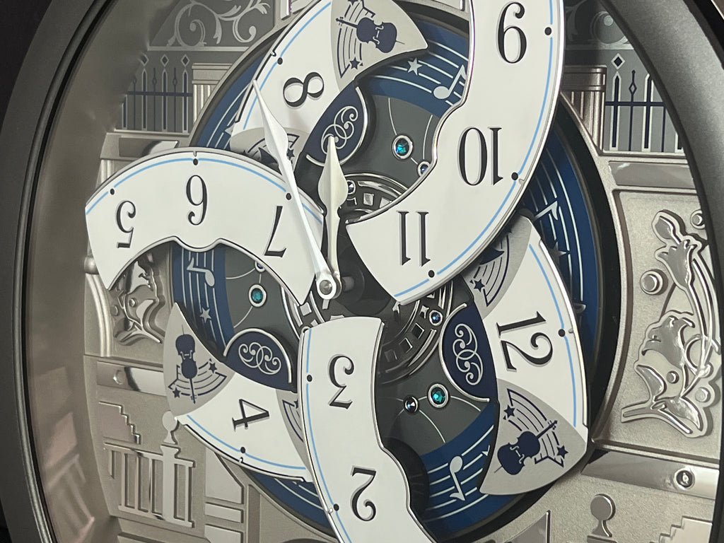 Seiko QXM366SRH “Musical Motifs” Melodies in Motion Dancing Dial Musical Wall Clock with 18 Songs