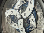 Seiko QXM366SRH “Musical Motifs” Melodies in Motion Dancing Dial Musical Wall Clock with 18 Songs
