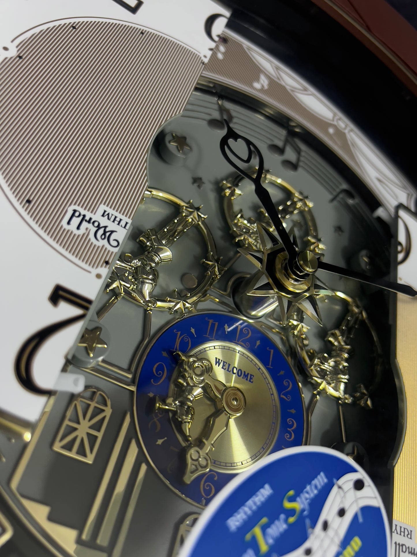 Rhythm “Palacio” Moving Dial Magic Motion Musical Wall Clock - 4MH439WU06