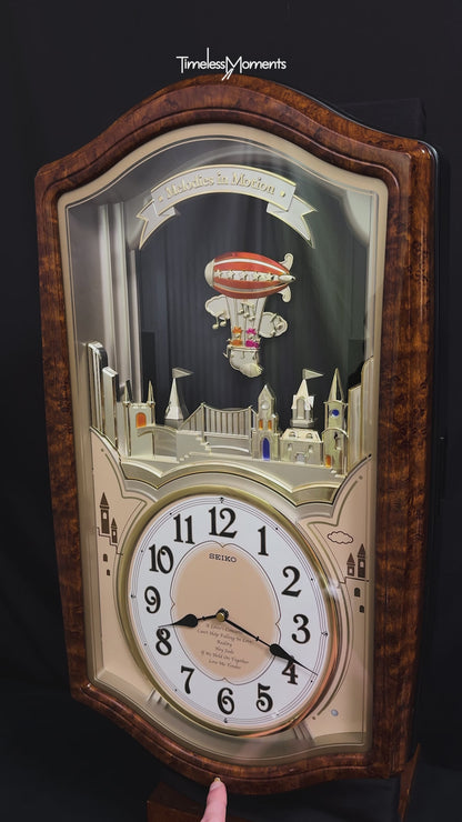 Seiko QXM135BRH "Lover’s Castle" Melodies in Motion Musical Moving Wall Clock with Popular Melodies