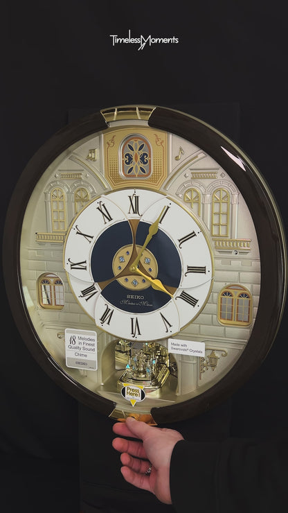 Seiko QXM371BRH “Castle Windows” Melodies in Motion Dancing Dial Musical Wall Clock