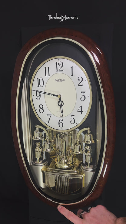Rhythm "Golden Ringers" Magic Motion Musical Wall Clock with Animated Figurines - 4MH740NR23