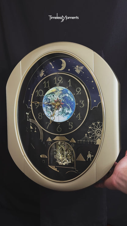 Rhythm “Peaceful Cosmos” Moving Earth Dial Magic Motion Musical Wall Clock with Popular Melodies - 4MH751AR19