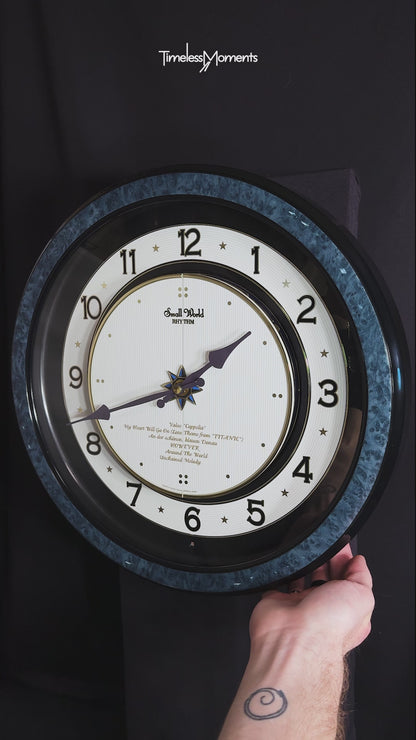 Rhythm “Small World Partage Home (Blue)” Moving Dial Magic Motion Musical Wall Clock with Popular Melodies - 4MH754RH04