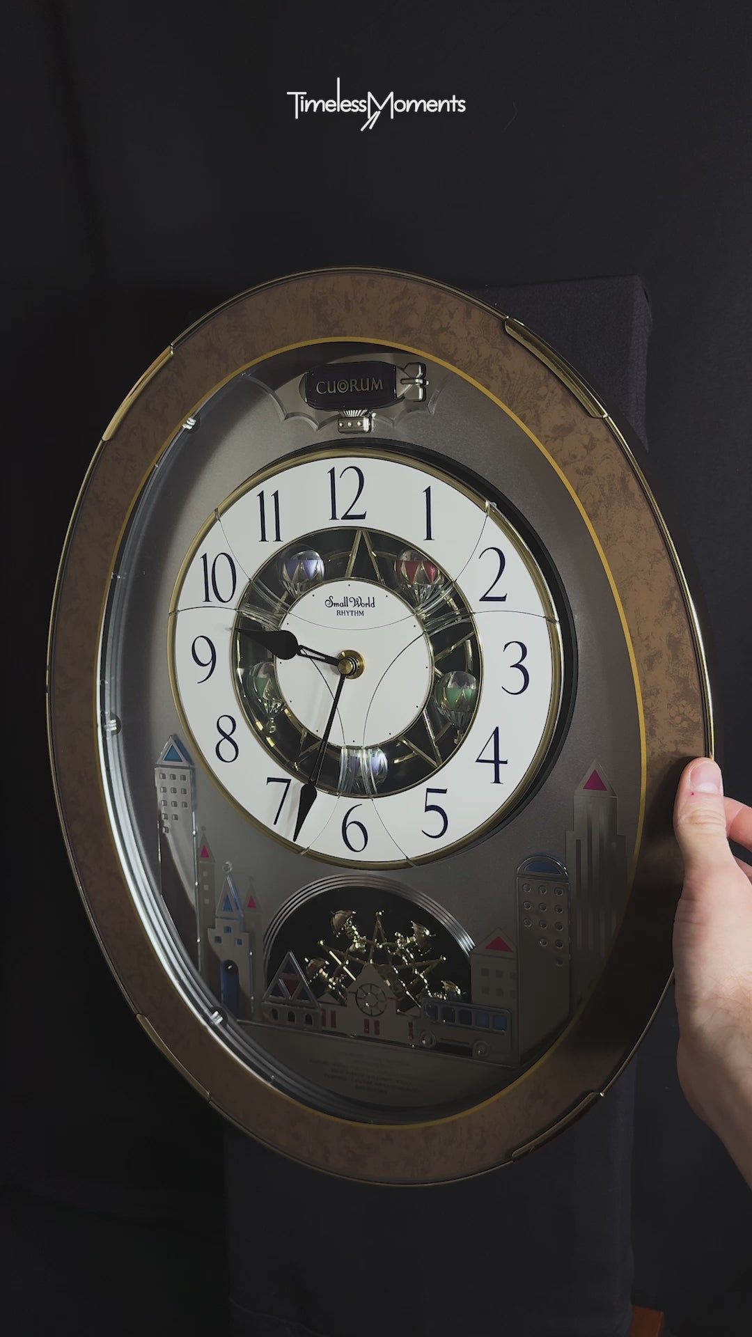 Rhythm “Tri-Cracker” Moving Dial Magic Motion Musical Wall Clock