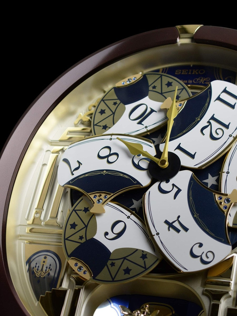 Seiko QXM356BRH "Golden Pillars" Melodies in Motion Dancing Dial Musical Wall Clock with 18 Songs