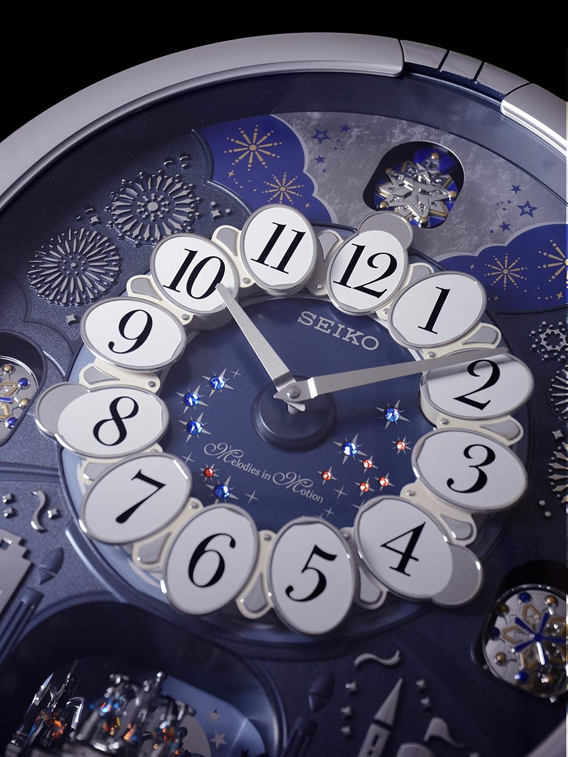 Seiko QXM379SRH “Glittering Starry Night” Melodies in Motion Dancing Dial Musical Wall Clock with 19 Songs