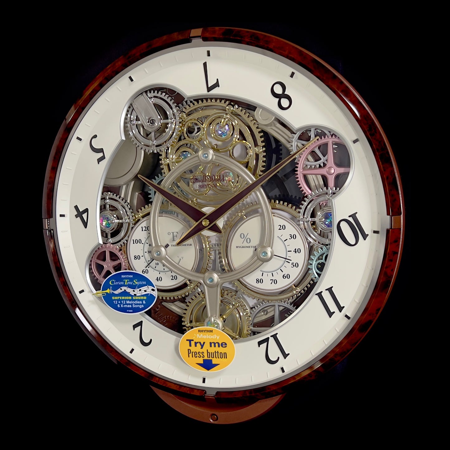 Rhythm “Widget (Woodgrain)” Skeletonized Dial Magic Motion Musical Wall Clock with Moving Gears - 4MH886WU23