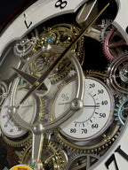 Rhythm “Widget (Woodgrain)” Skeletonized Dial Magic Motion Musical Wall Clock with Moving Gears - 4MH886WU23